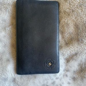 Auth Chanel black leather camellia vertical long wallet